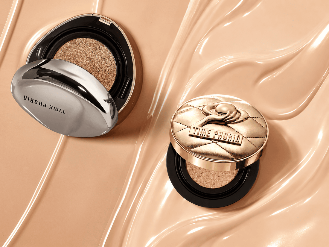 Two cushion foundation compacts on a peach background, one beside a smooth surface and the other beside a glossy, flowing texture.